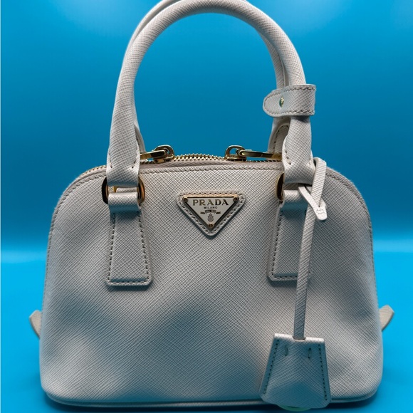 Prada Handbags - Prada Cream Mini Leather Bag